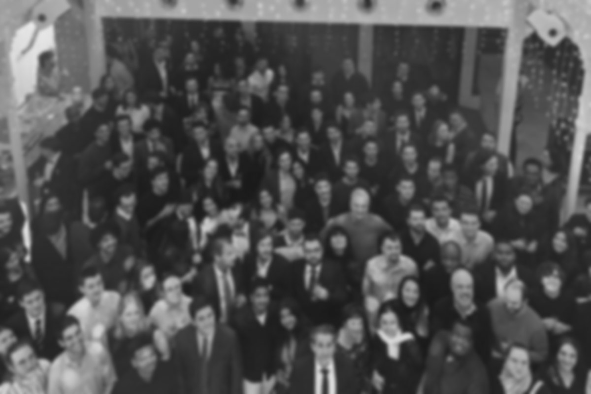 TOROW teams gathered at an evening event, in black and white
